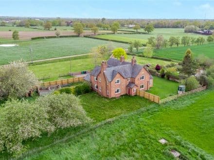 Farmhouse with a range of traditional farm buildings (lapsed planning for 3 dwellings) within 3.72 acres.