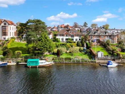 A riverside apartment enjoying panoramic views directly across the river Dee, with parking, garaging and mooring .